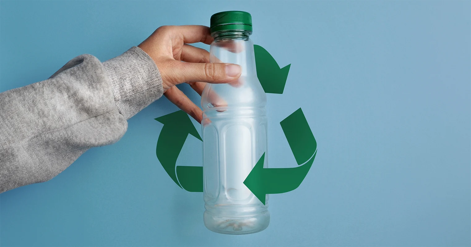 Post-consumer recycled Plastic Bottle Hold by a hand